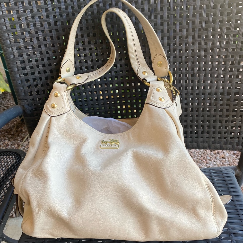 Coach purse. Leather. I believe color is called bone. Gently used